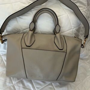 Large gray leather bag with shoulder strap.
